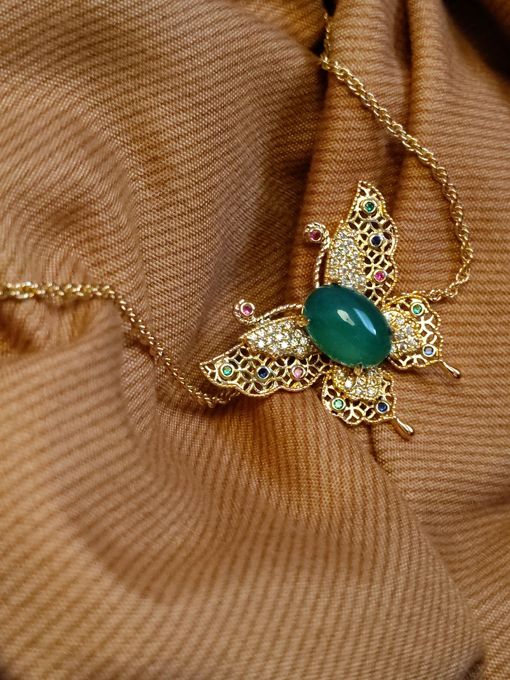 Gold Butterfly Pendant Necklace with Green Gem